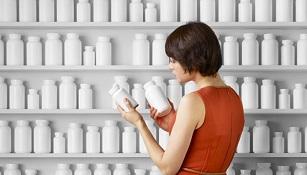 woman-holding-bottle-of-supplements.jpg