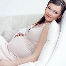 pregnant-woman-lying-on-couch.jpg