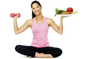 woman-holding-dumbbell-and-plate-of-vegetables.jpg