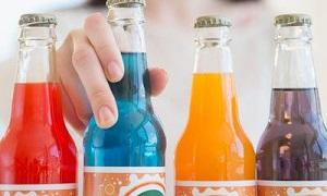 woman-picking-bottle-of-soda.jpg