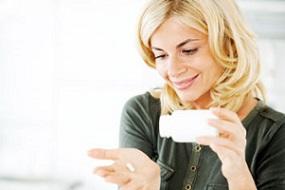 woman-holding-bottle-and-supplement.jpg