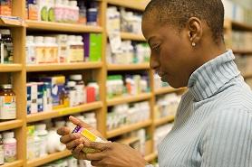 photo-of-woman-holding-bottle-of-supplement.jpg