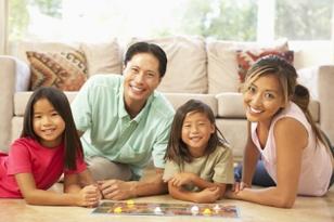 portrait-of-happy-family-playing-board-game.jpg