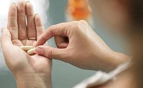 photo-of-woman-holding-supplements.jpg