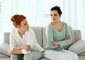 two-women-sitting-on-couch.jpg