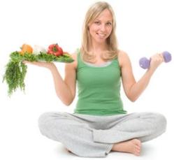 photo-of-woman-holding-dumbbell-and-food.jpg