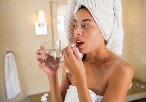 photo-of-woman-holding-glass-of-water-and-supplement79_392.jpg