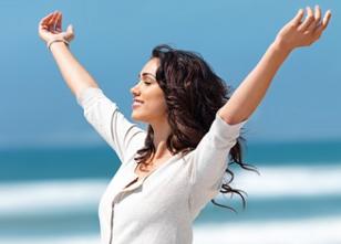 photo-of-woman-on-beach-with-arms-up.jpg