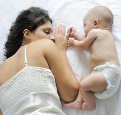 mother-sleeping-with-her-baby.jpg