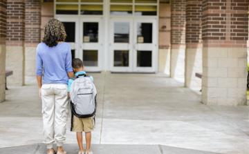 photo-of-woman-with-child-in-front-of-the-school.jpg