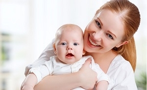 Mom and Baby Smiling at Camera