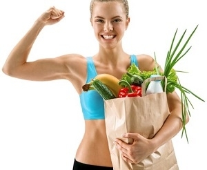 Fit Woman Holding Basket of Food