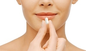 Woman Holding Pill Supplement