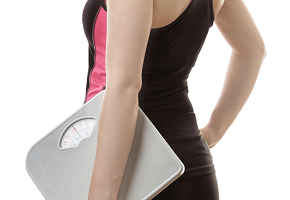 Woman Holding Weighing Scale
