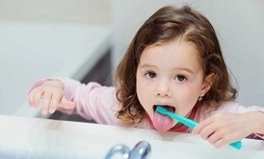 Child Cleaning Her Tongue