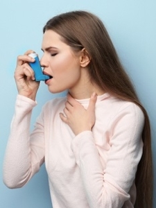 Photo of Woman Using Inhaler