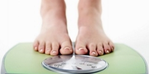 Woman on Weighing Scale