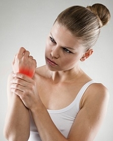 Woman Holding Her Wrist with Gout