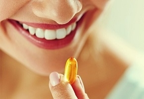 Woman Taking Omega 3 Fish Oil