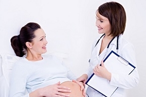 Pregnant Woman with Doctor