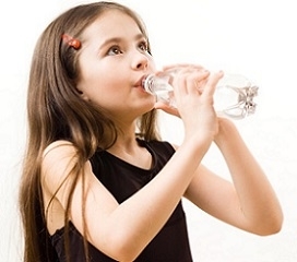 Child Drinking Bottle of Water