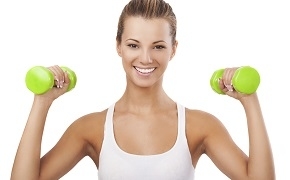 Happy Blonde Woman Exercising with Weights